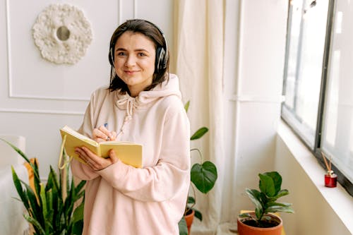 A Woman Writing on a Planner