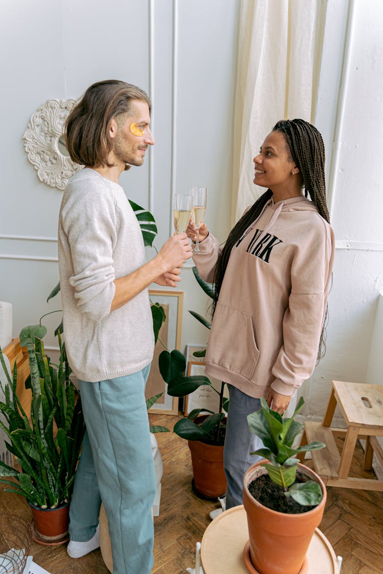 Man And Woman Clinking Champagne Glasses 