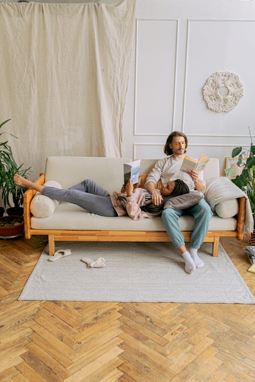 A Couple Reading Books in the Living Room