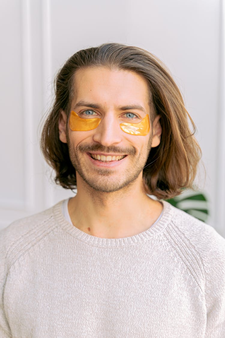 Portrait Of Smiling Man With Under Eye Patches