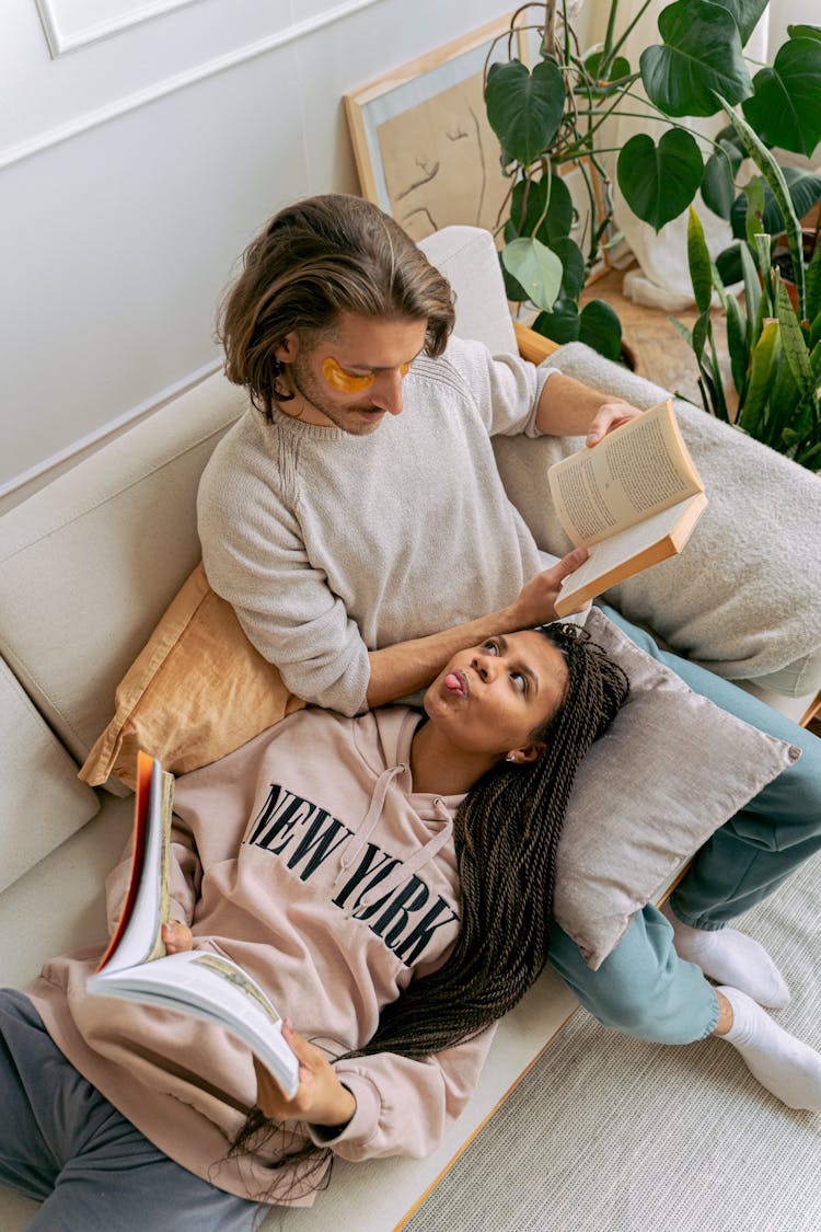 Couple Read Books And Relaxing Together