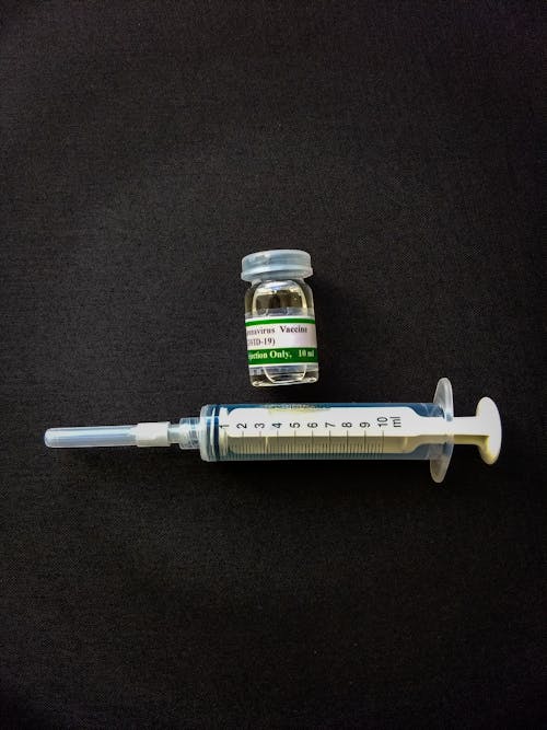 Free A Vial and Syringe on a Flat Surface Stock Photo