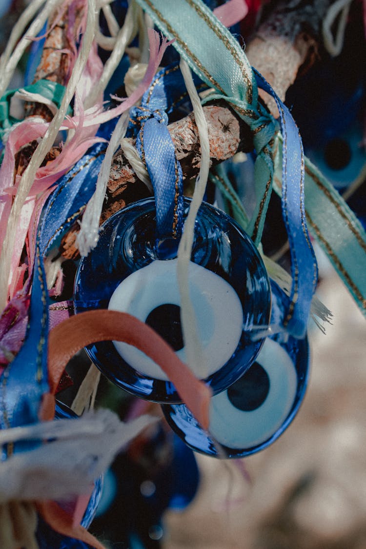 Eye Of The Prophet Talismans Hanging On A Branch