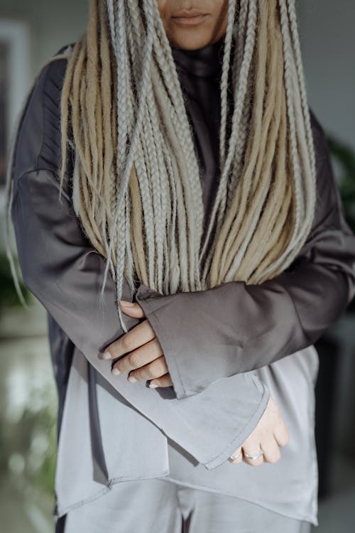 A Person in Braided Hair Wearing Gray Turtleneck Long Sleeves