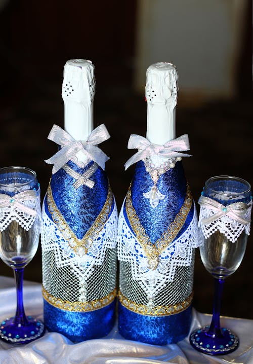 Champagne Bottles and Glasses Decorated for Wedding Reception