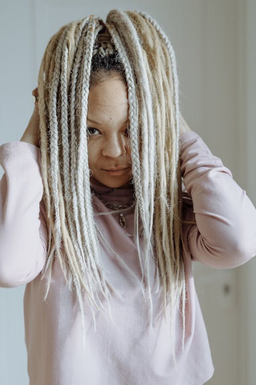 A Woman with Afro Braids Hairstyle