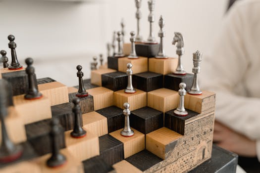 3D chessboard with metal chess pieces on a wooden tiered design, showcasing creativity.
