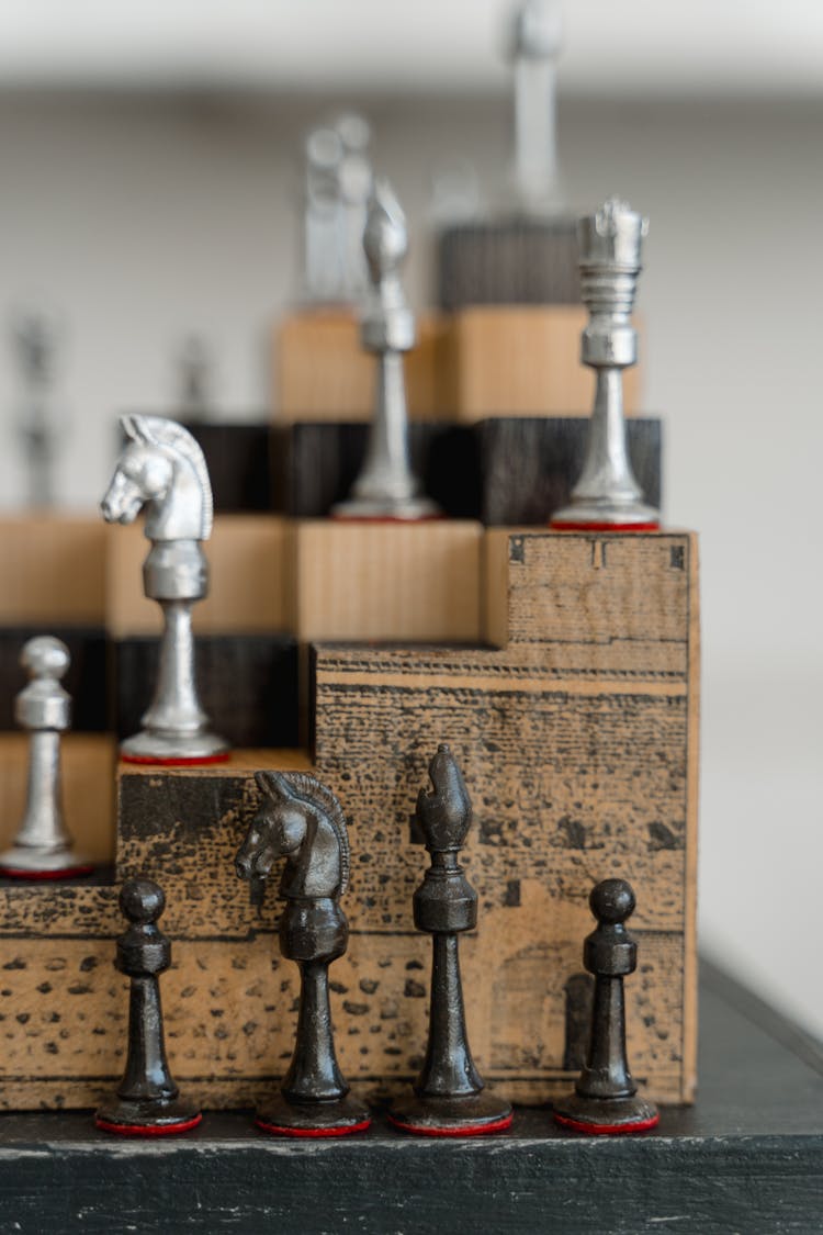 Chess Pieces On Wooden Shelf