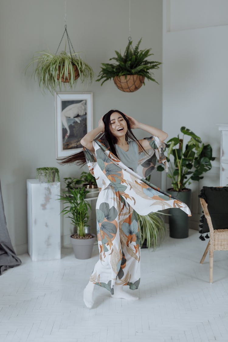 A Woman Dancing In The Living Room