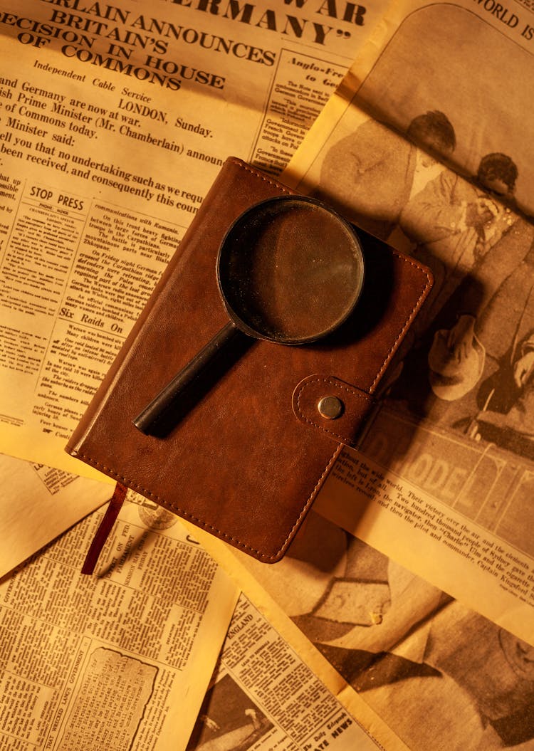 A Magnifying Glass Over A Journal