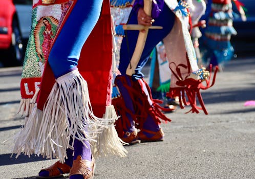 Colorful dancers in traditional attire celebrate a street festival in Reno.