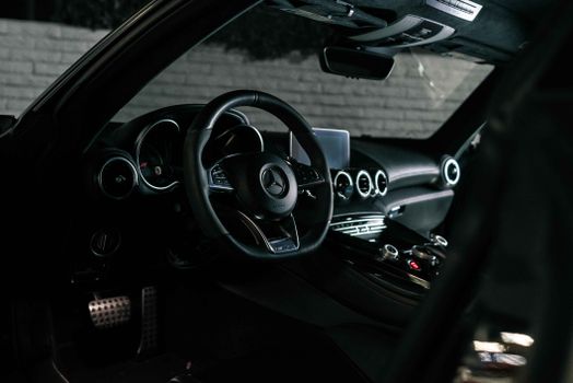 Elegant Mercedes-Benz interior with a focus on the steering wheel and dashboard in Los Angeles.