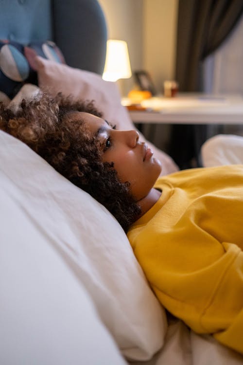 Free Girl Lying Down on Bed Stock Photo