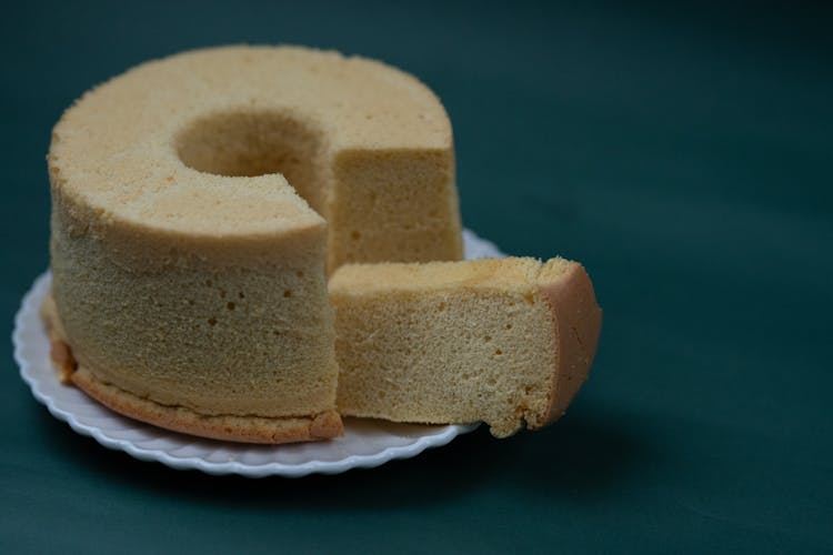 Cut Sponge Cake On White Plate