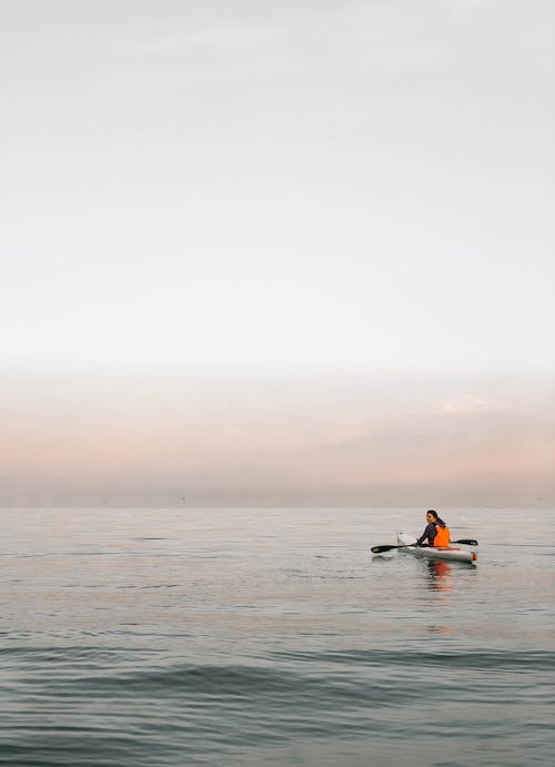 A Person Riding a Kayak on the Sea