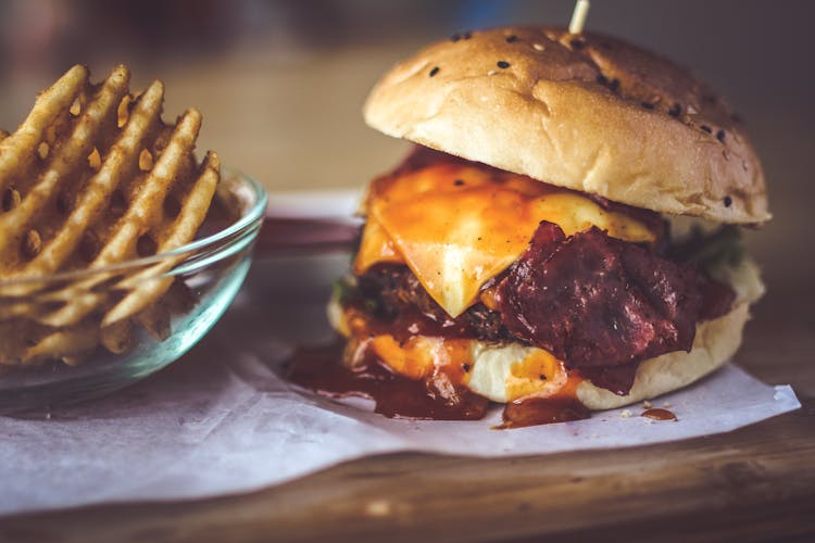 Closeup Photography Of Bun With Cheese, Patty, Egg, And Bacon