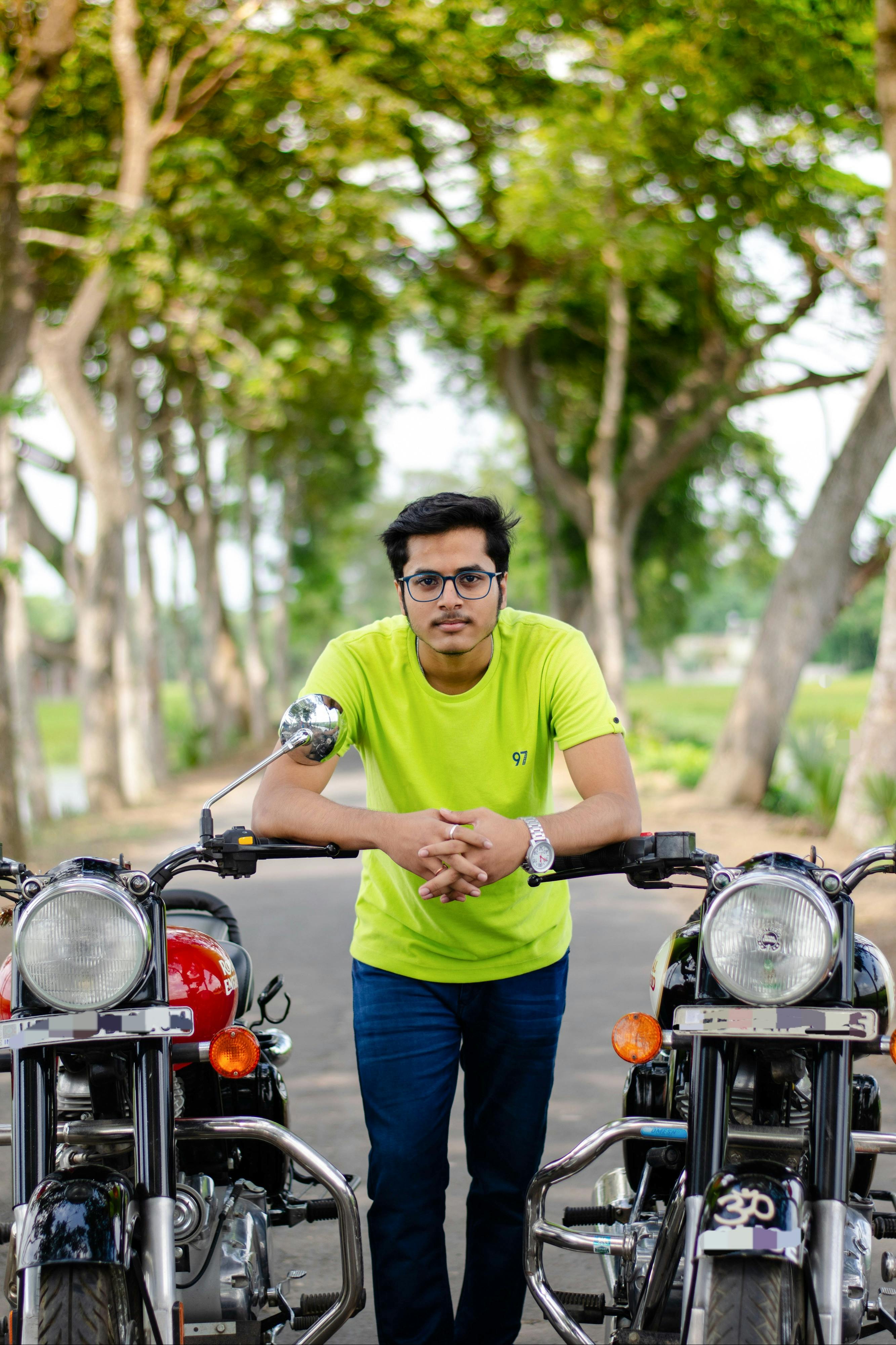 Premium Photo  Indian asian man riding modern scrambler motorbike on the  forest road having fun driving the empty road on a motorcycle tour journey
