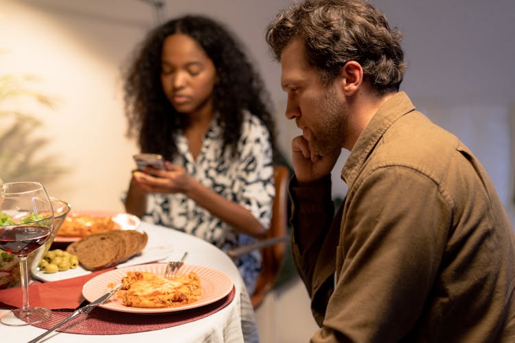 A Man Having Dinner With The Family