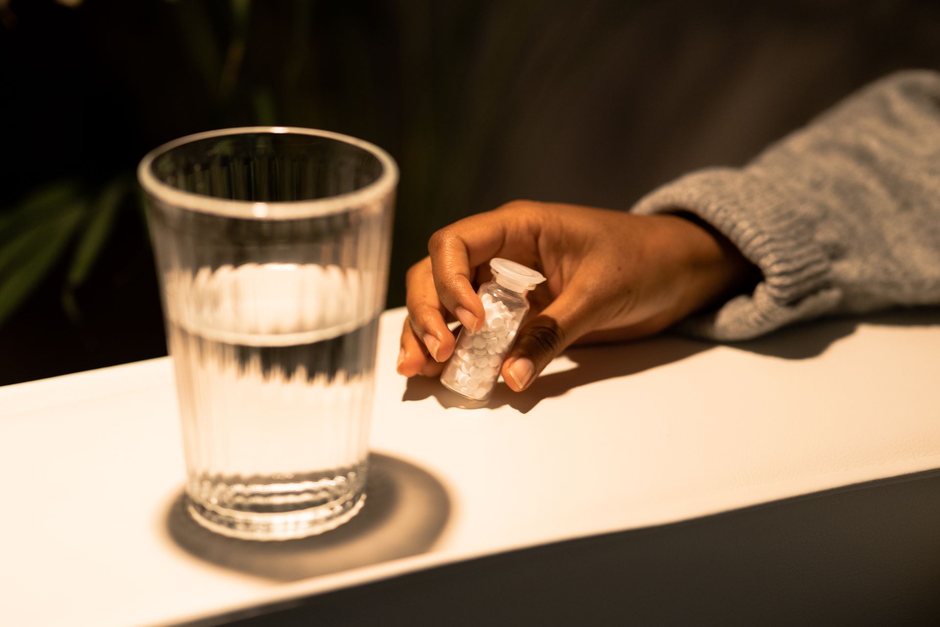 A Person Holding a Bottle of Pills