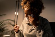 A Woman Wiping Her Tears with Tissue