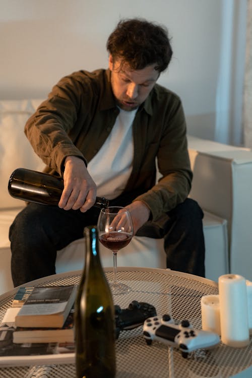 A Man Drinking Wine at Home