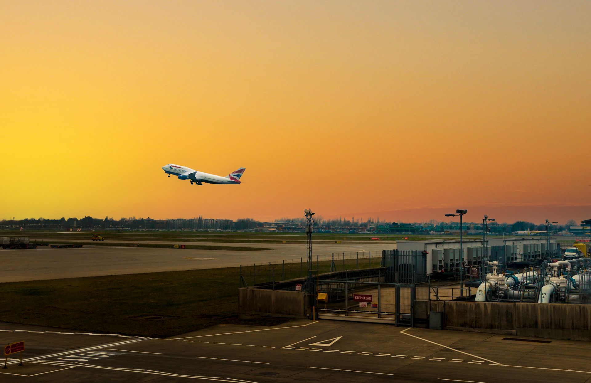 Aircraft on the runway and terminal at Heathrow Airport