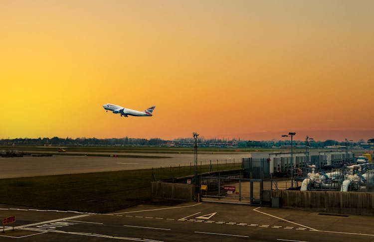 An Airplane Taking Off In An Airport