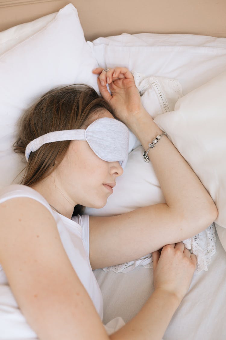 A Sleeping Woman With Sleep Mask On