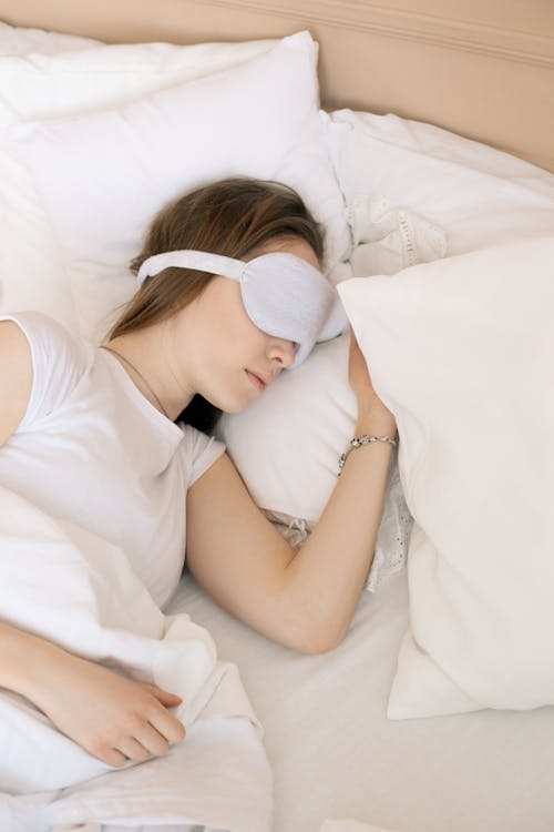 Free A Woman Sleeping with a Sleep Mask Stock Photo