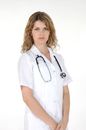Woman with Hoop Earrings Wearing White Scrubs