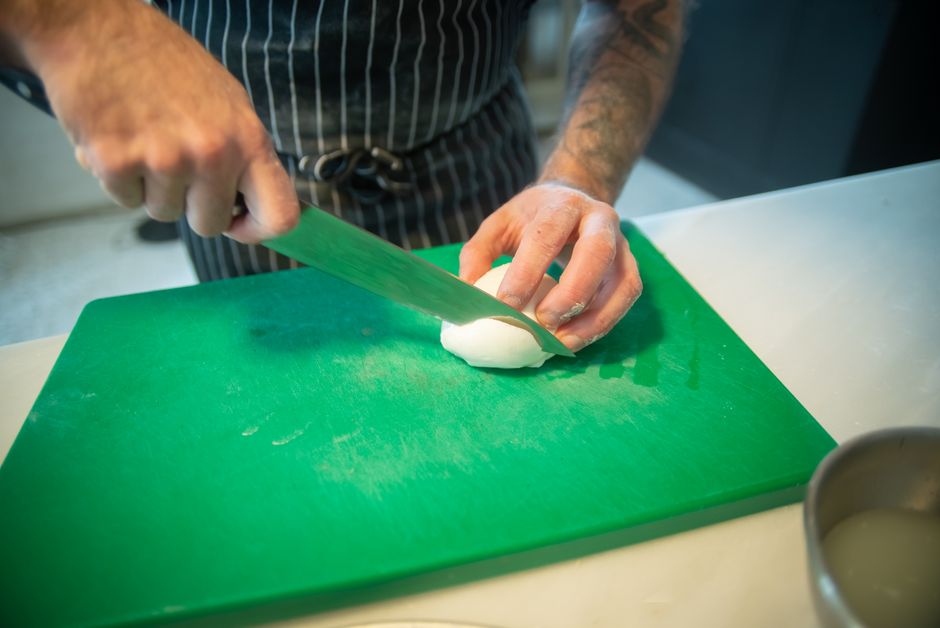 mozzarella cheese stretching hands