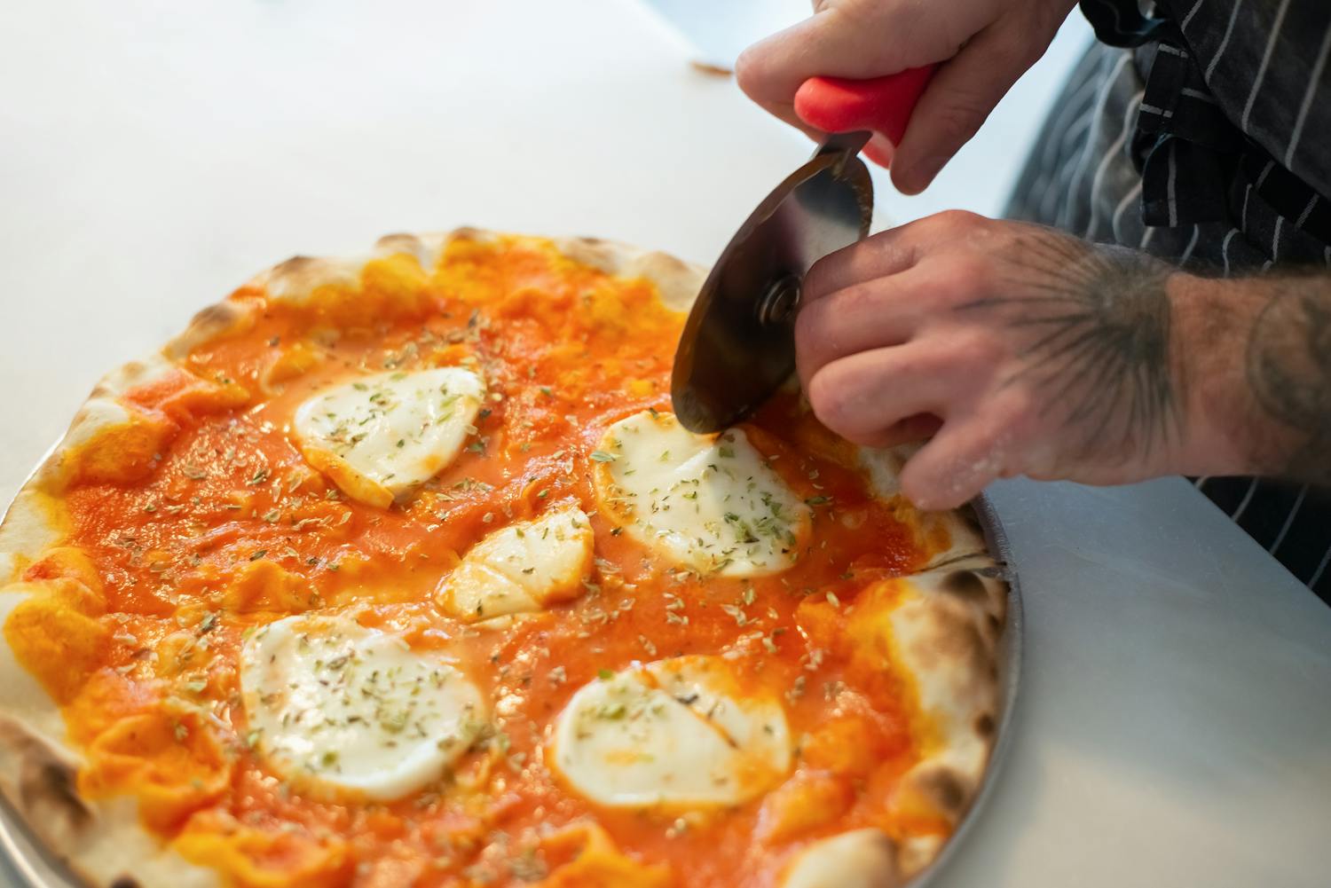 Chef presenting gourmet pizza