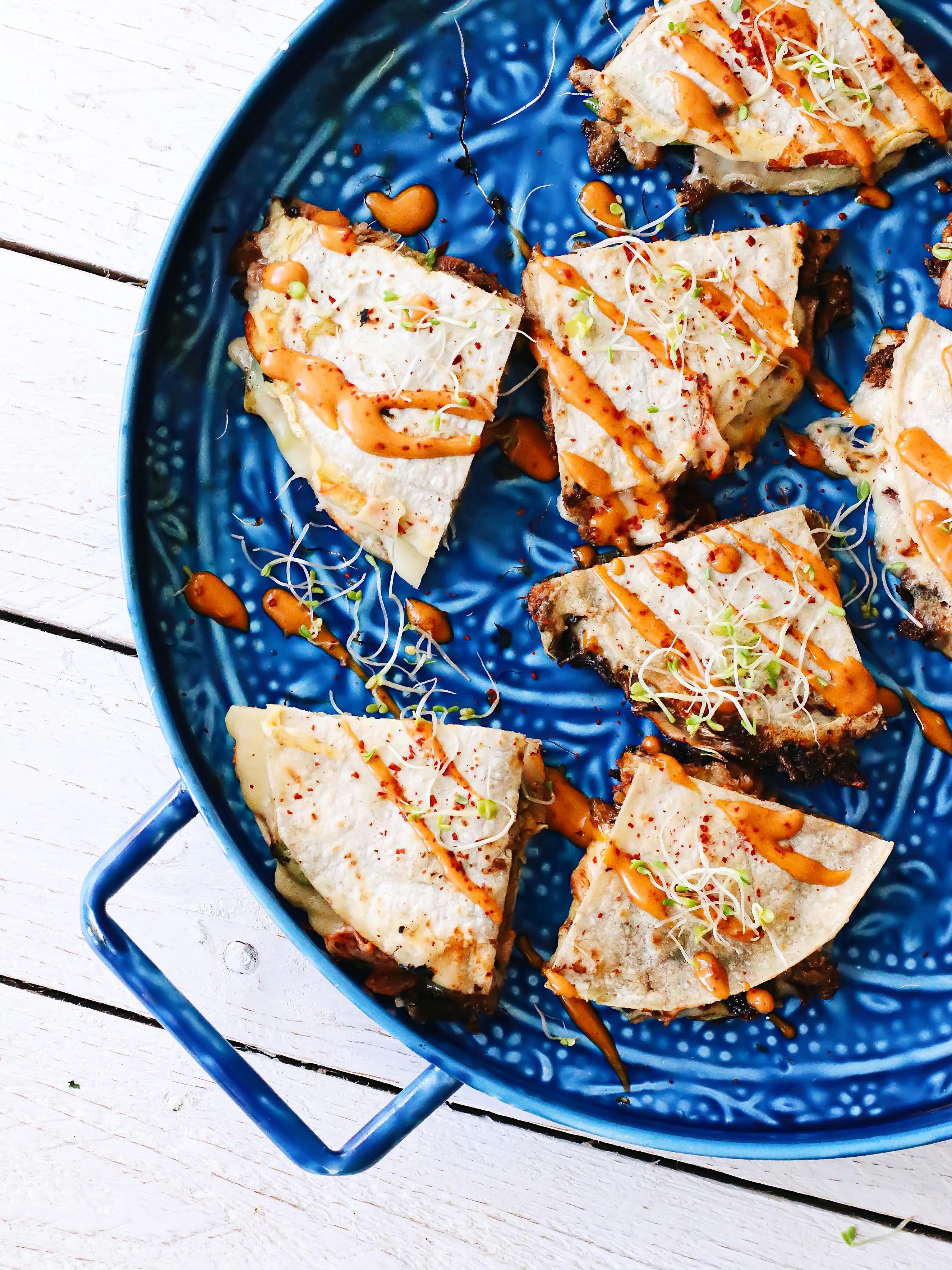 delicious tortilla with vegetables on blue plate