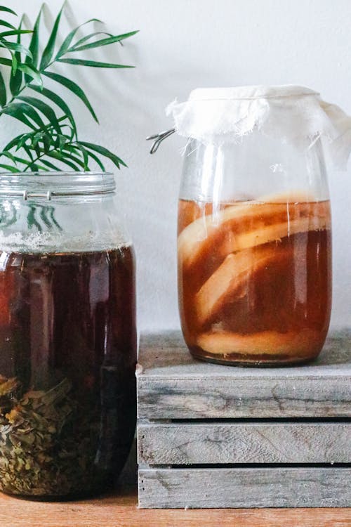 Free Jars with kombucha and dark herbal beverage Stock Photo