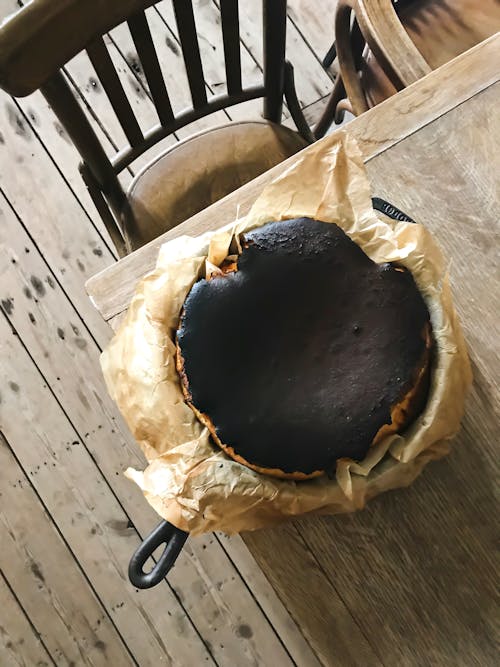 Free Burnt crisp of baking in skillet on table Stock Photo