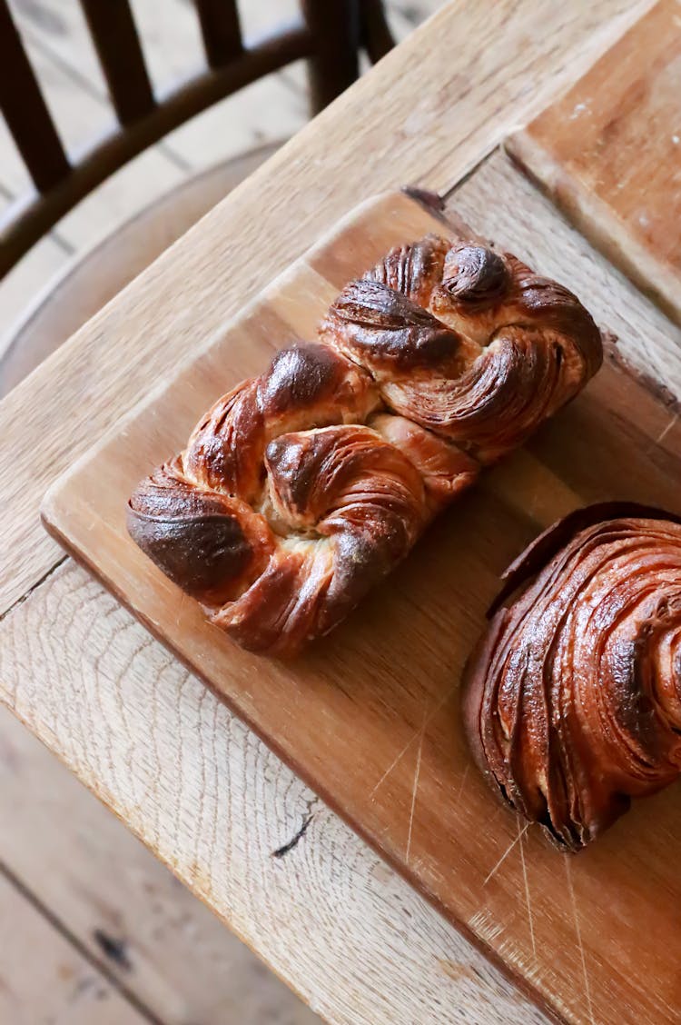 Fresh Baked Bun On Wooden Board