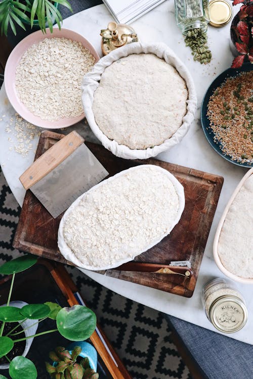 Free Top view of dough and ingredients prepared for baking bread on table in kitchen Stock Photo