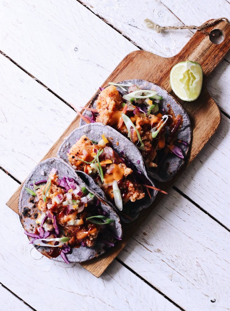 Delicious Taco With Slice Of Lime On Wooden Board