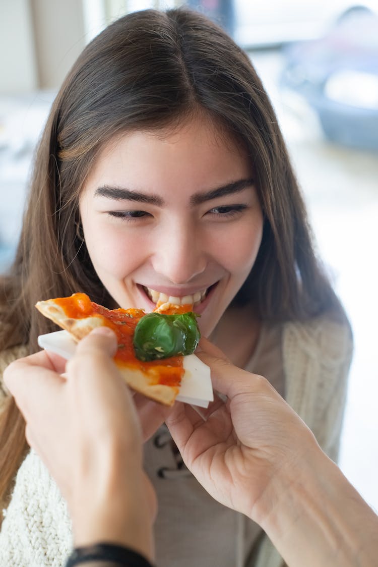 A Woman Eating Pizza 