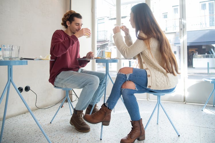 A Woman And Man Eating Together 