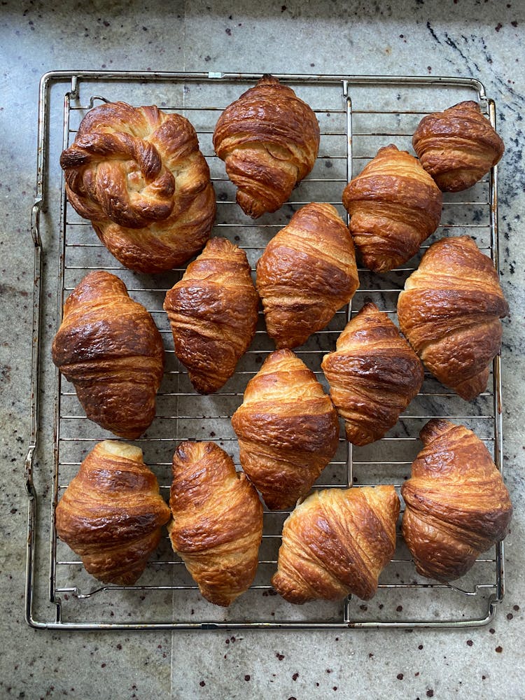 Fresh Croissants On Metal Rack