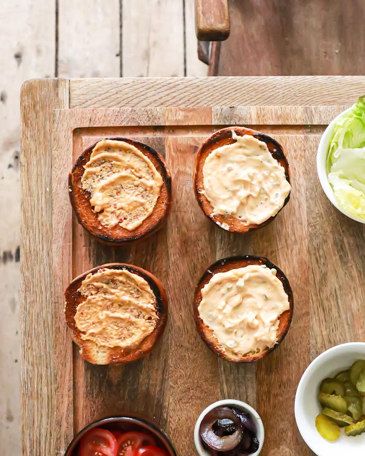 Burger Buns With Sauces On Table