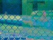 An Old Photo of a River Under the Rain Near a Chain Link Fence