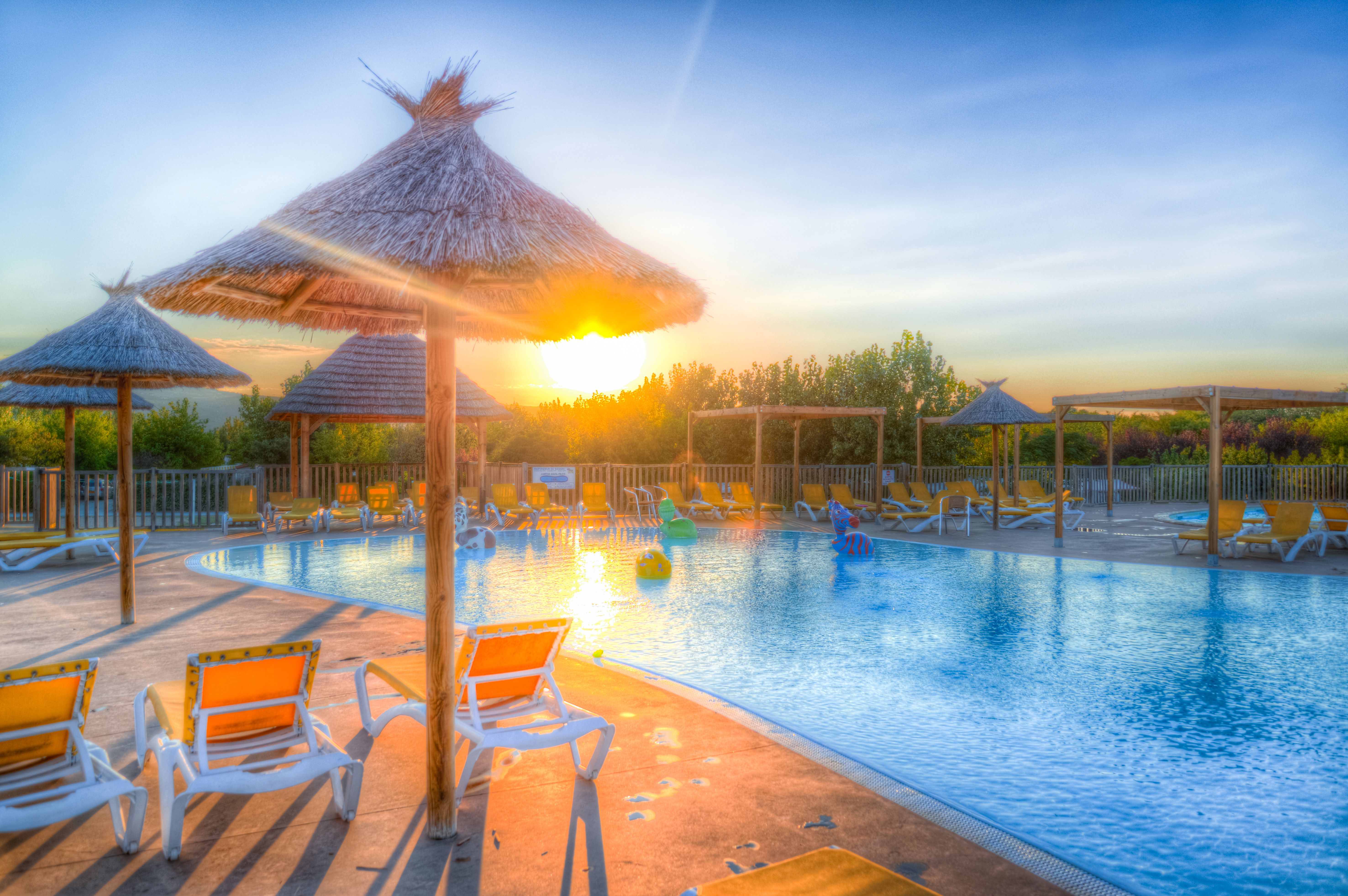 innovative luxury pool with in-water loungers and LED lighting - luxury apartments with pool