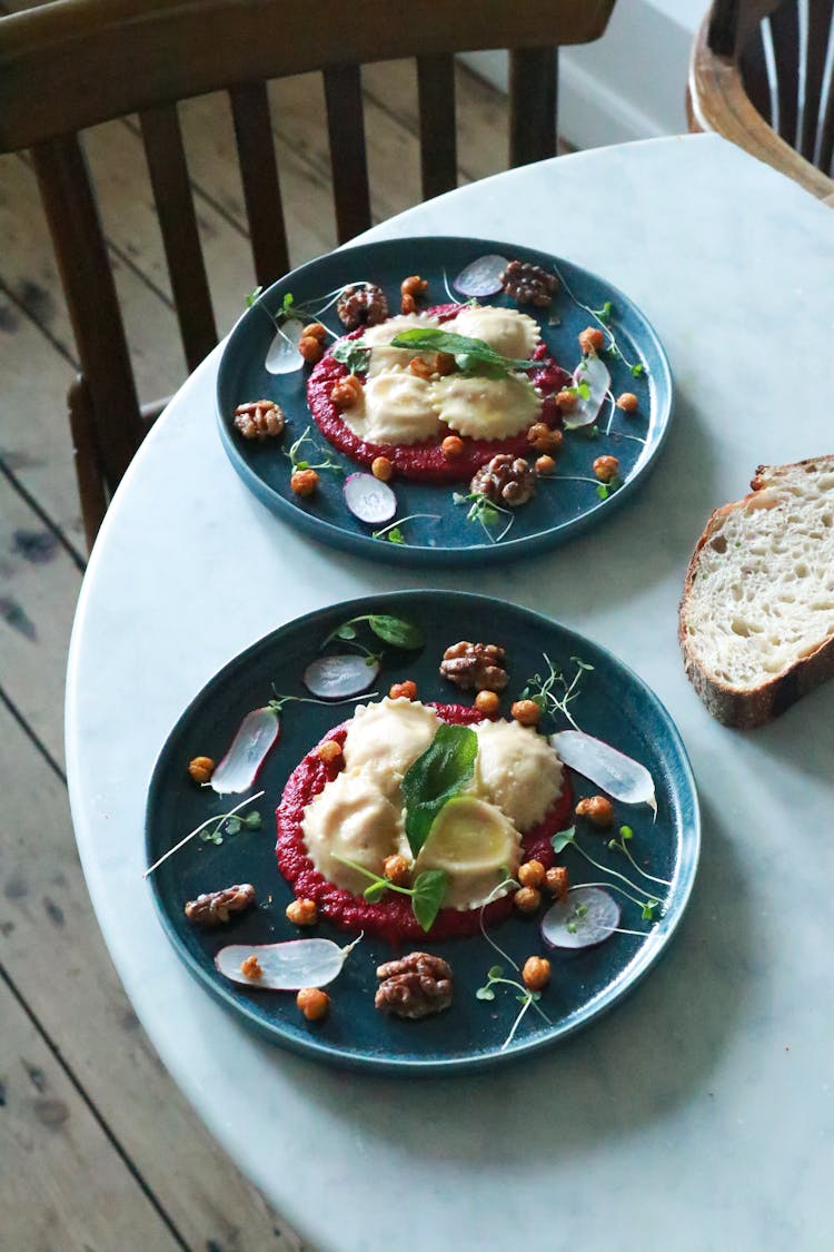 Appetizing Dish With Ravioli Served In Plates In Restaurant