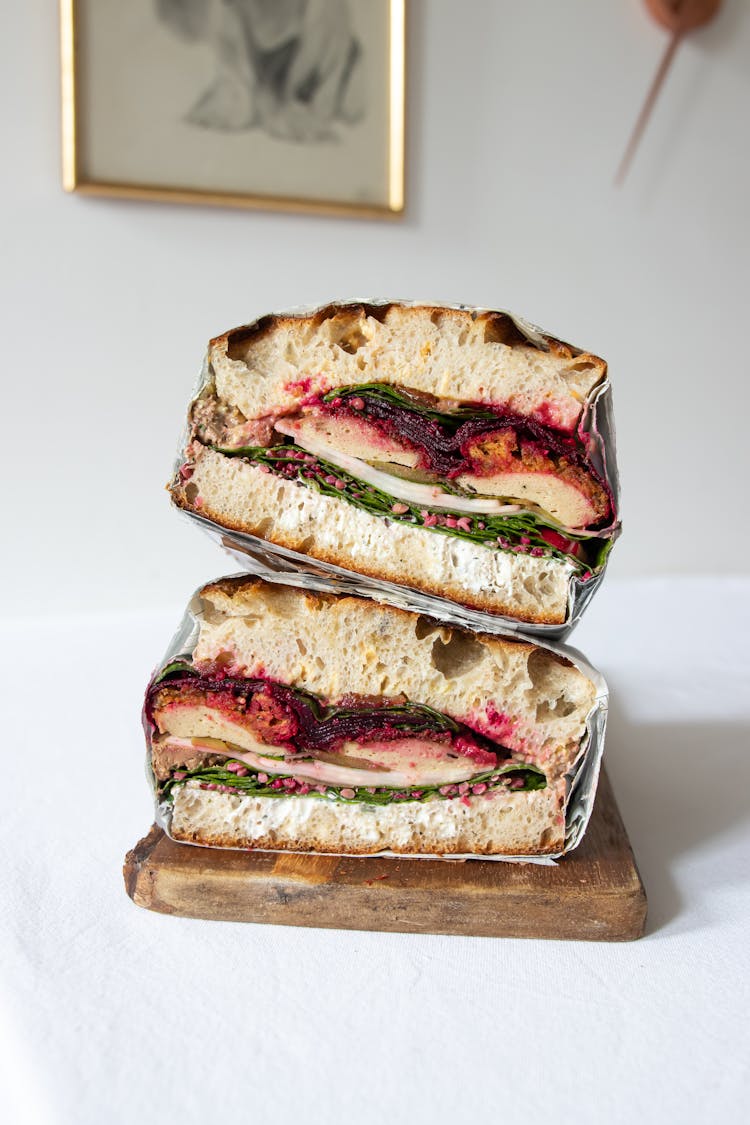 Appetizing Sandwiches Served On Wooden Board In Restaurant