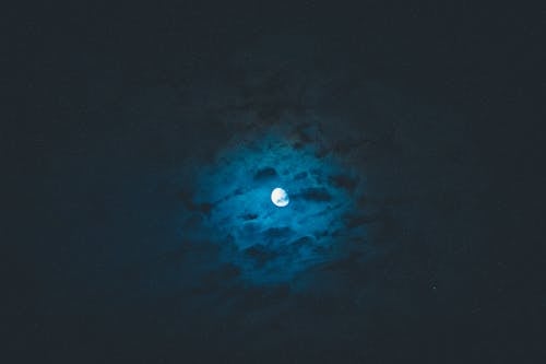 Free Moon shining on dark sky Stock Photo