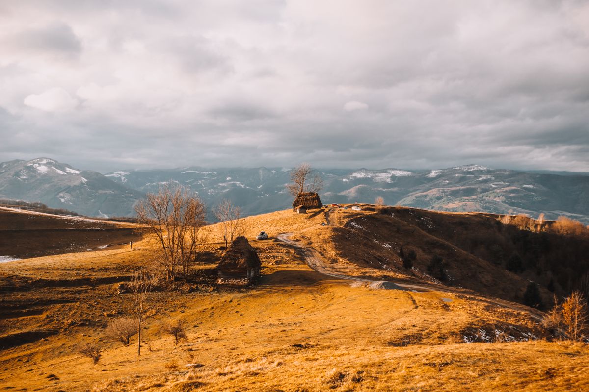 A hut on a grassy summit