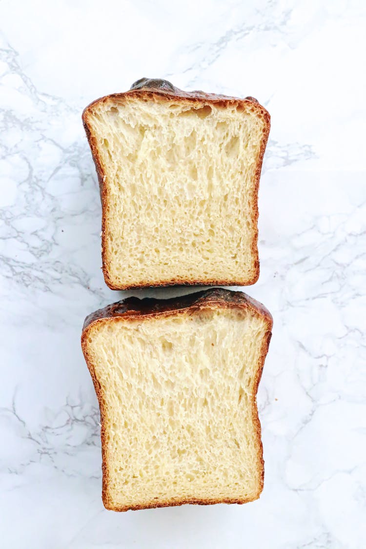 Fresh Bread On White Table In Kitchen