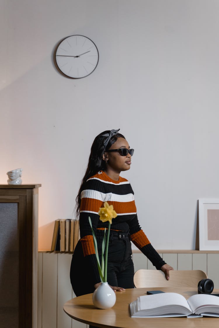 A Blind Woman Standing On The Dining Room